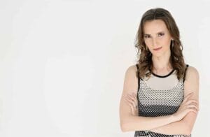 Nathalie Lussier posing with arms crossed