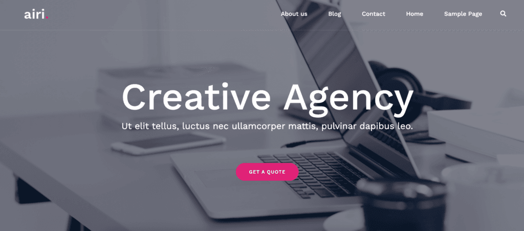 Airi theme demo site. Greyed out background, white text and a pink button