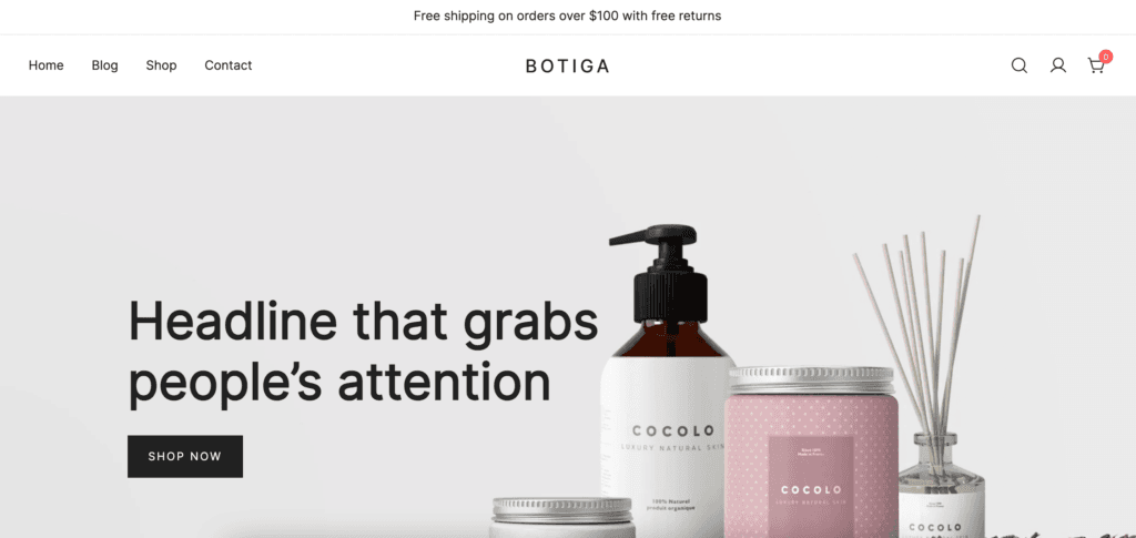 Botiga demo site, a free feminine WordPress theme. Beauty products make up the background image, alongside black text and a black button.